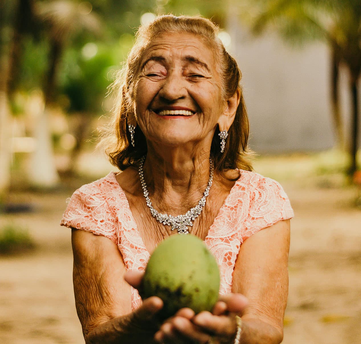 A joyful senior woman laughing