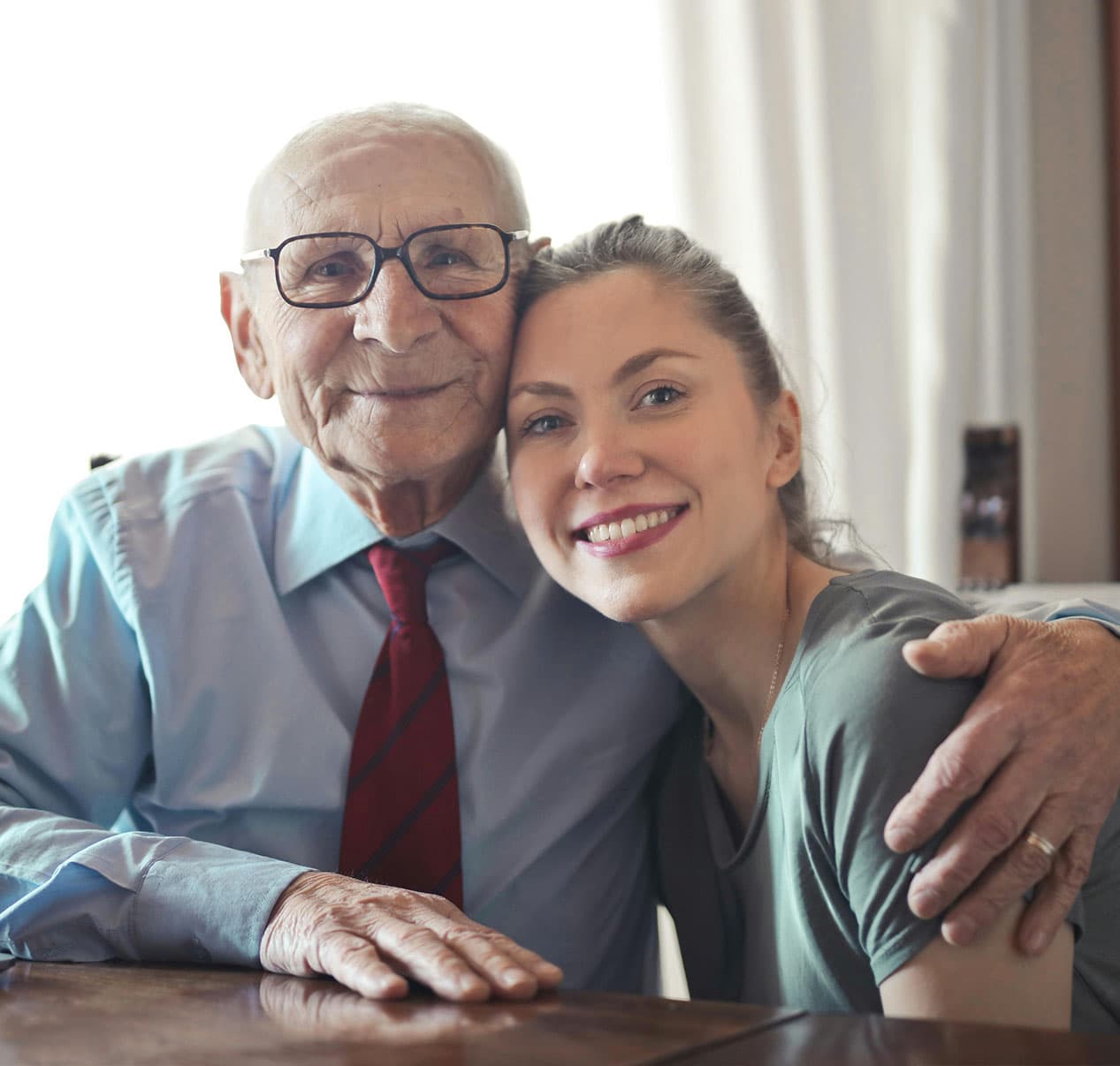 A father and daughter sharing a warm embrace